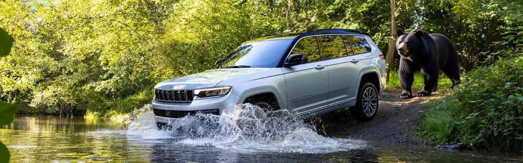 2026 Jeep Grand Cherokee crossing a river
