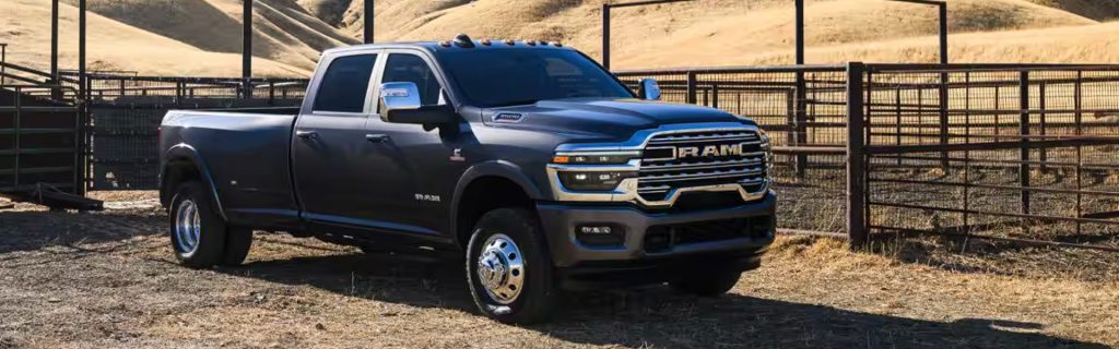 2026 RAM truck with bold design on rugged terrain.